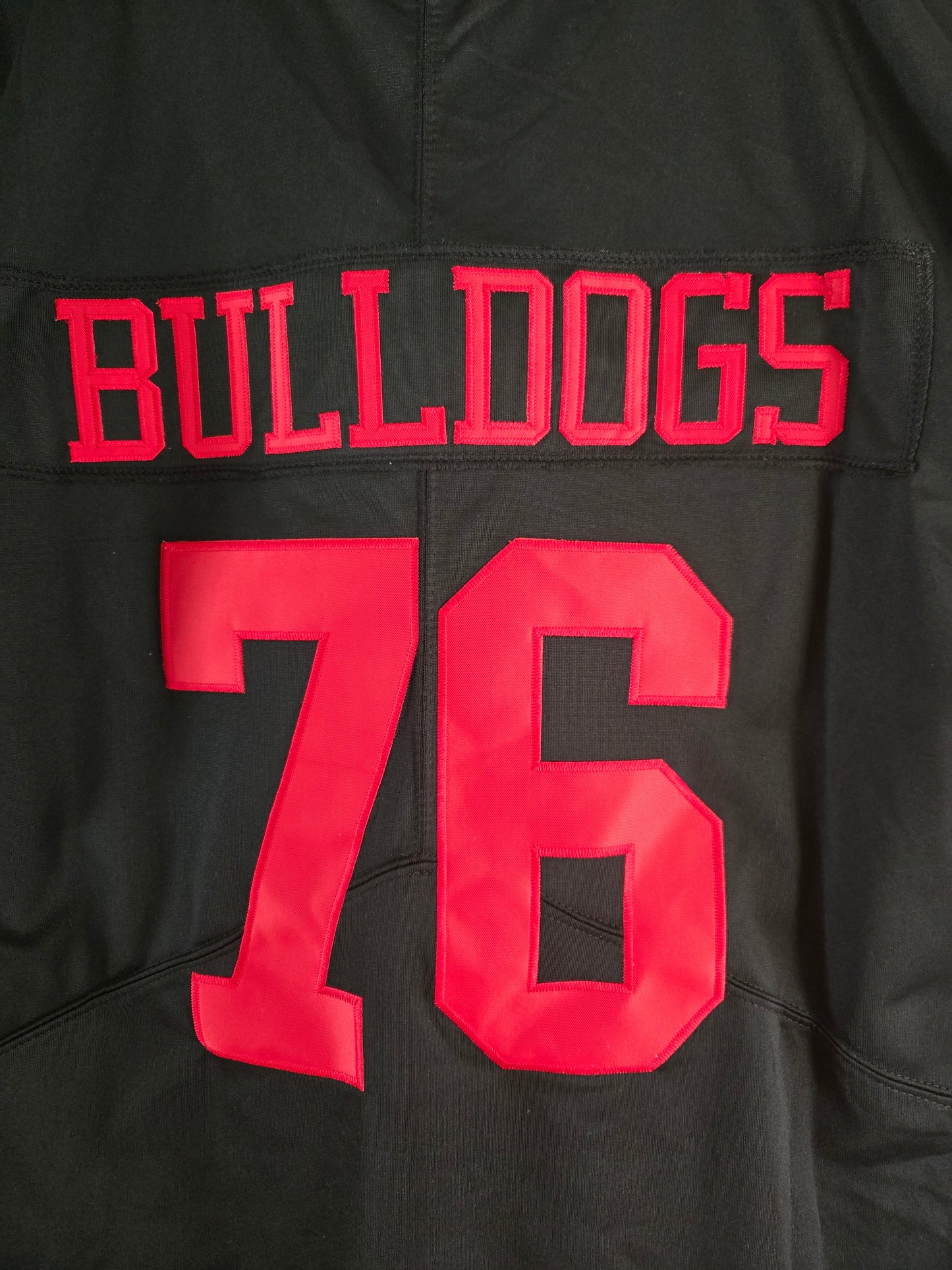 American Football Trikot Bulldogs Nummer 76 Oversize schwarz rot weiß